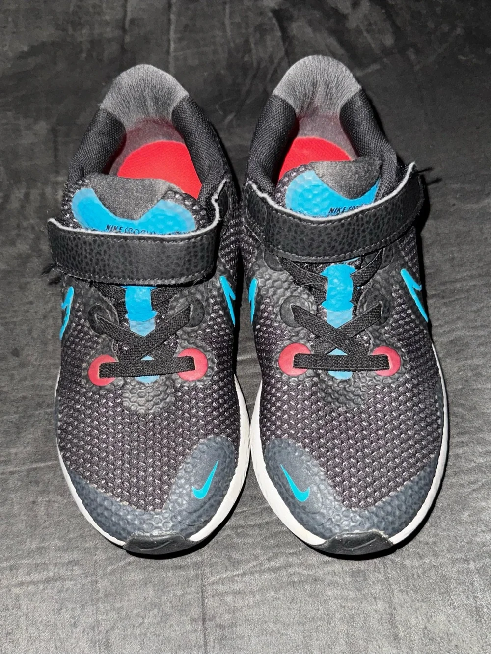 Renew Nike Kids size 13. Running Black Sneakers with Blue and neon pink .